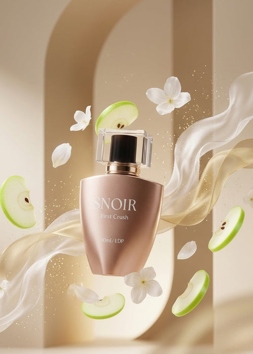 Perfume bottle with floral and apple slice elements on a beige background