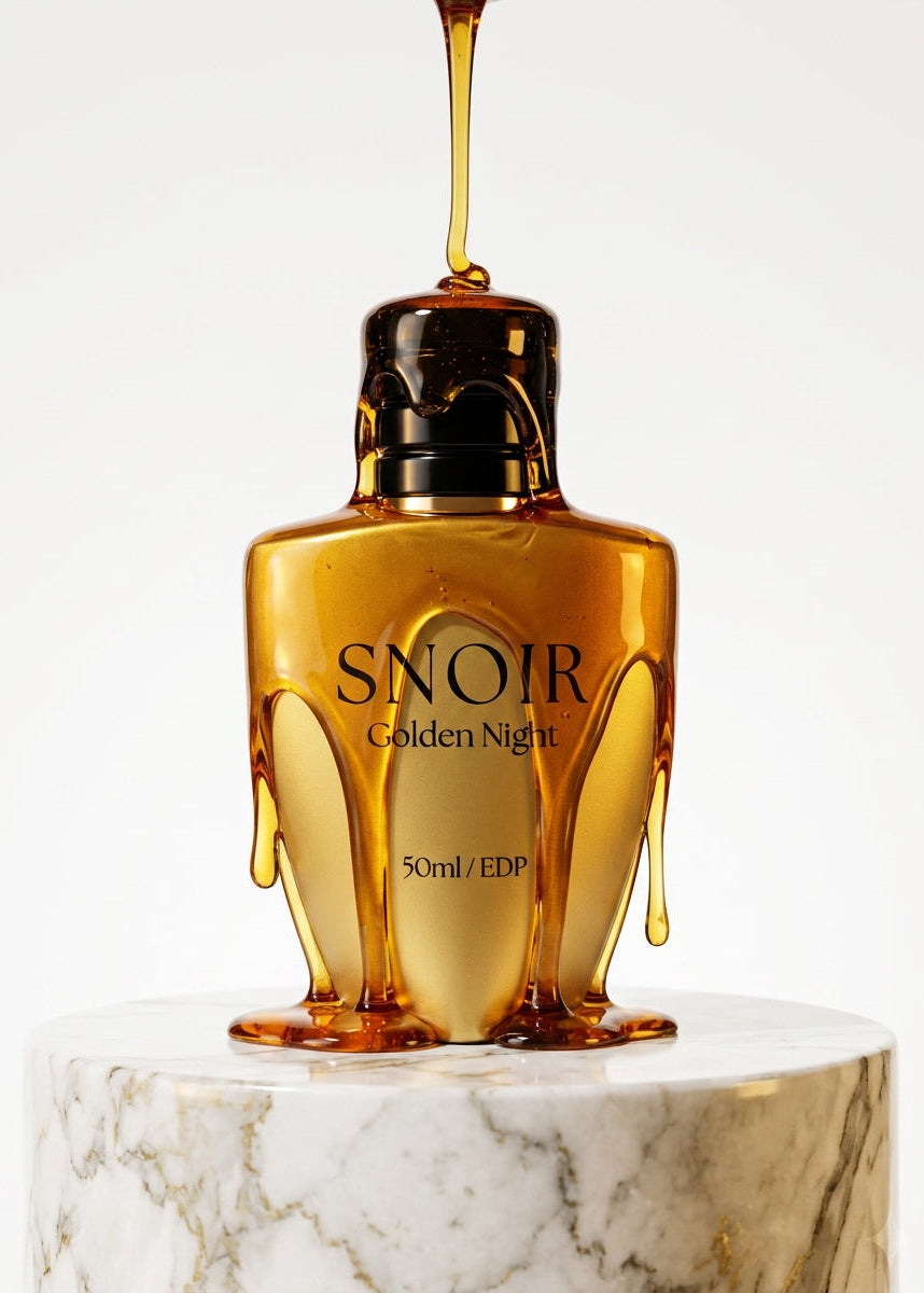 SNOIR Golden Night perfume bottle with liquid being poured on a marble surface