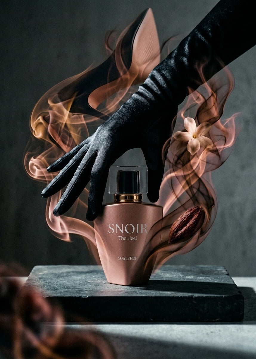 Perfume bottle with a hand and smoke effects on a dark background